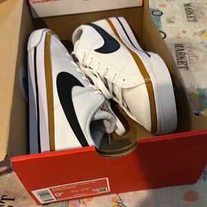 Nike Women’s White and Gold Sneakers